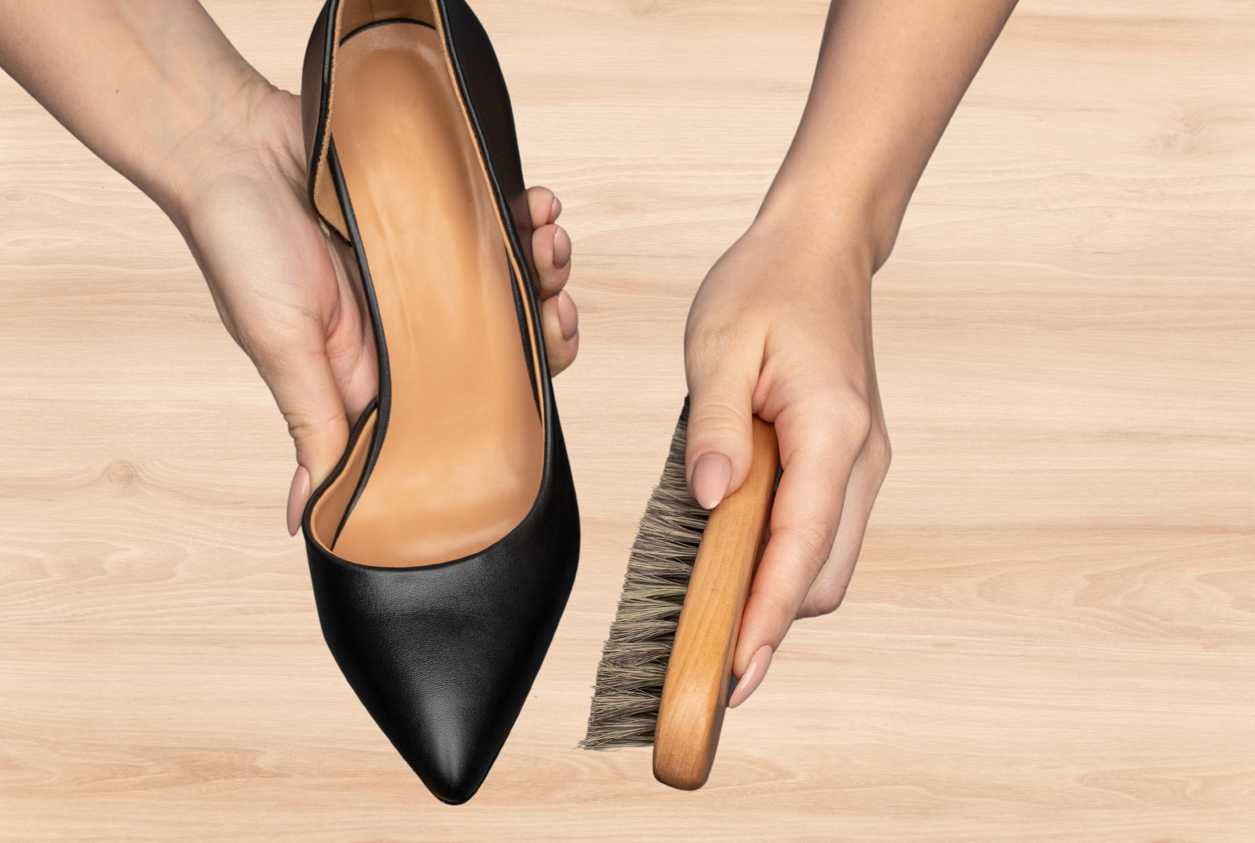 women caring for leather shoe