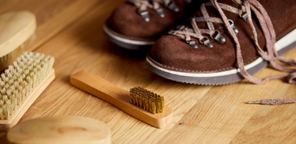 women cleaning suede boots