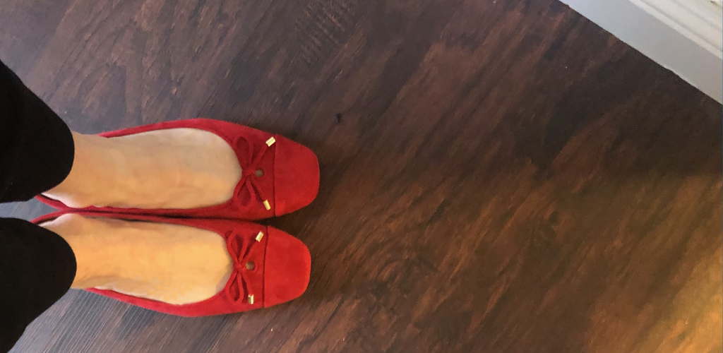 pair of red flat teacher shoes