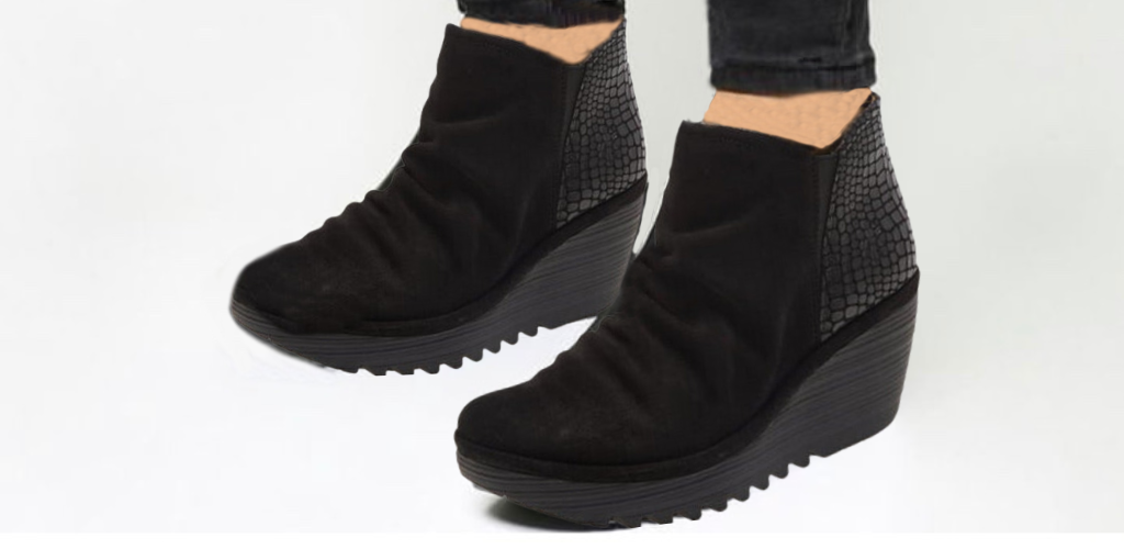 Pair of black suede wedge boots