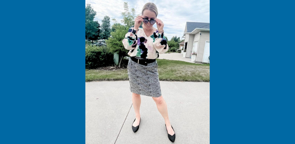 stylish women in cute work skirt and black with black flats