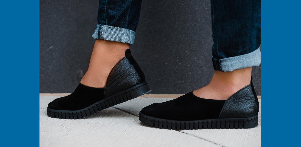 Stylish women wearing cuffed jeans and black suede Bendy