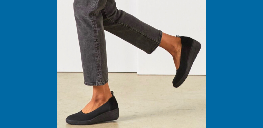 vionic lacey black wedge on foot