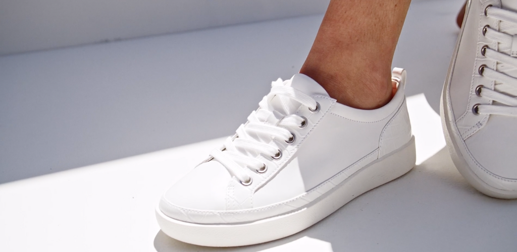 Vionic Whinny white leather sneaker on stylish women in jeans