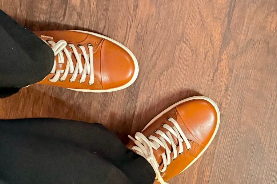 leather sneaker with black trousers